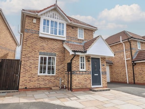 A two-story brick house with a front door, windows, and a tiled roof. - 4 Murrayfields (Newcastle-upon-Tyne)