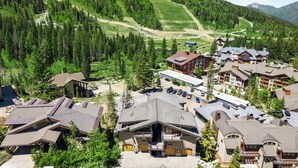 A mountain resort with multiple buildings, a ski slope, and a parking area. - Alpine Creek #2 - Club Solitude Access, Walk to Lifts (Solitude)