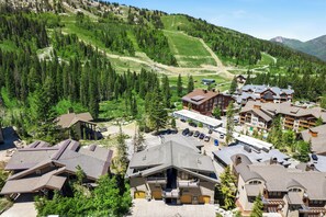 A mountain resort with multiple buildings, a ski slope, and a parking area. - Alpine Creek #2 - New Rental in Solitude Village! (Solitude)