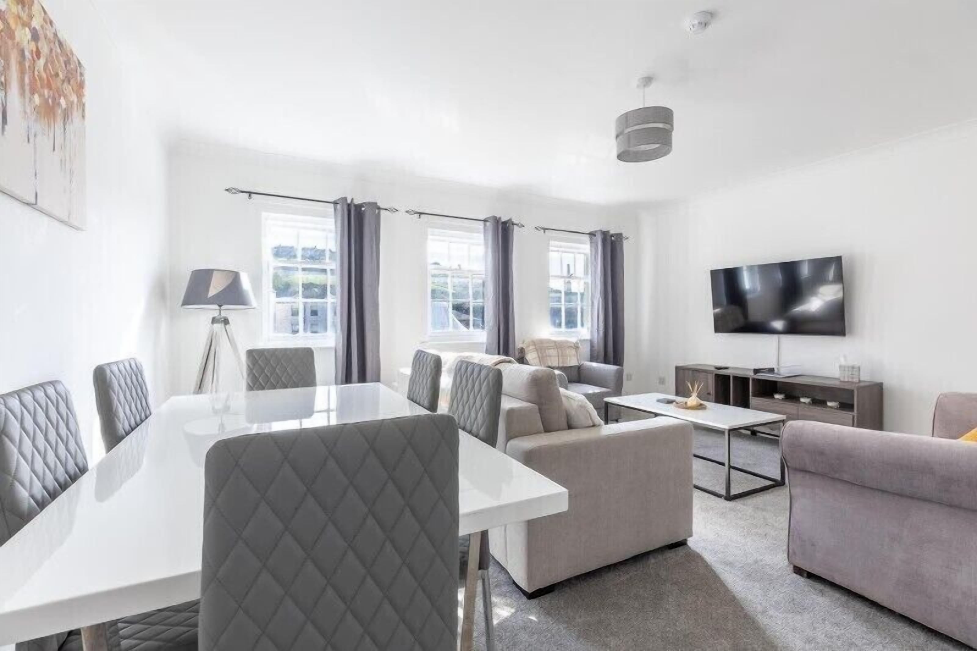 Spacious living room filled with abundant sunlight for a bright and welcoming atmosphere.