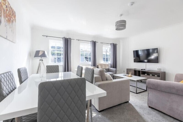 Spacious living room filled with abundant sunlight for a bright and welcoming atmosphere.