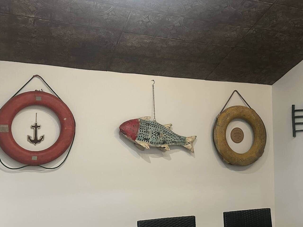 Three circular objects hanging on a wall, each with a different design.