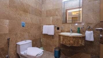 Junior Suite | Bathroom | Shower, rainfall showerhead, hair dryer, slippers