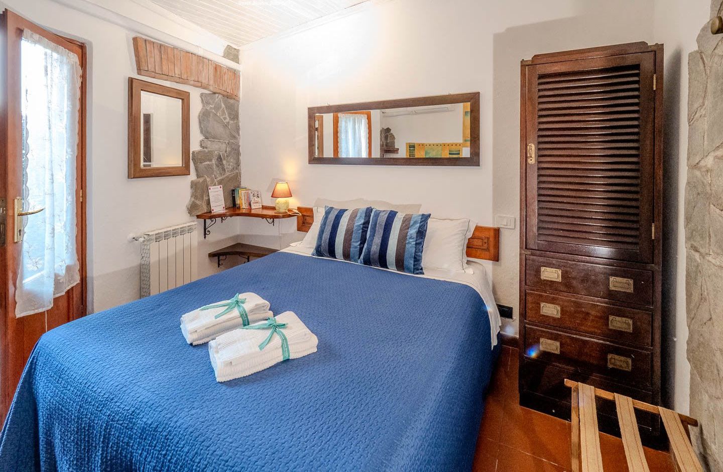Double bedroom with wooden wardrobe