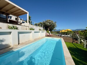 A swimming pool with a wooden deck, a red slide, and a yellow umbrella. - VillaSerenita Heated Pool, Jacuzzi, Ping Pong (ALATA)