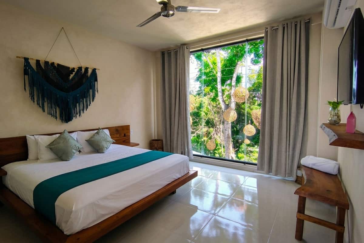 Deluxe Double Room, Patio, Pool View | Individually decorated, free WiFi, bed sheets
