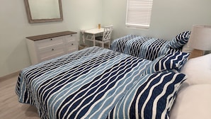 A bedroom with a bed, a desk, a chair, a dresser, a ceiling fan, and a window with blinds. - Golden Hour: - BRAND NEW 2026 - sunsets, beach, and park in perfect proximity. (Spanish Wells)