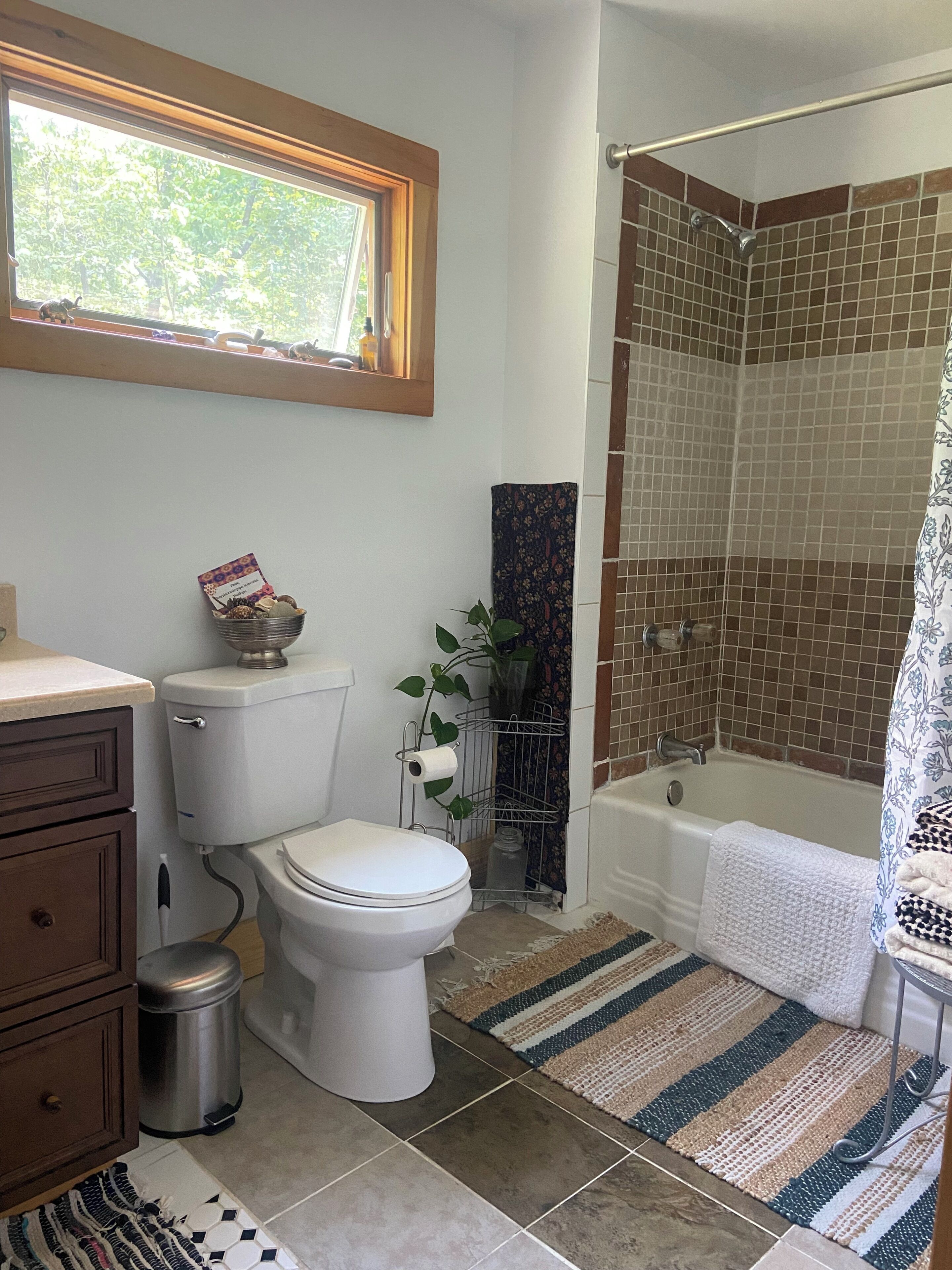 A bathroom with a toilet, bidet, and shower area.