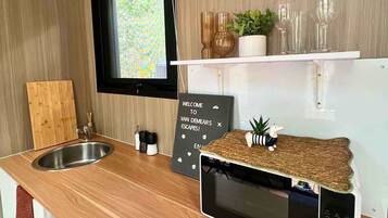 Fridge, microwave, stovetop, coffee/tea maker