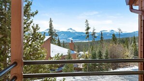 A mountain view with snow-covered peaks and pine trees. - The Buffalo Lodge | Hot Tub • Stunning Mtn Views! (Silverthorne)