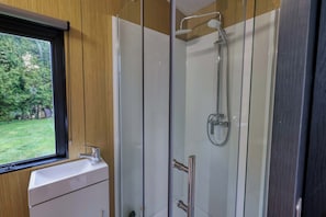 Shower, hair dryer, towels, shampoo