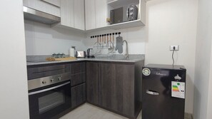 Apartment | Private kitchen - Oceana Suites Briones Luco La Cisterna (La Cisterna)