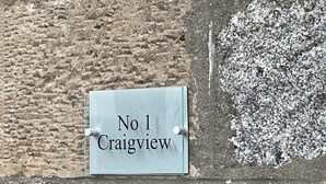 A sign with 'No 1 Craigview' on a textured wall. - Central location, Its our home away from home unique, cosy and charming. (Boat of Garten)