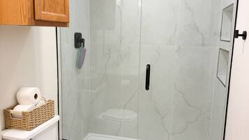 Shower, hair dryer, towels, soap
