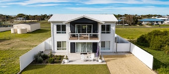 Modern Coastal Retreat | Walk to the Beach | Sleeps 12