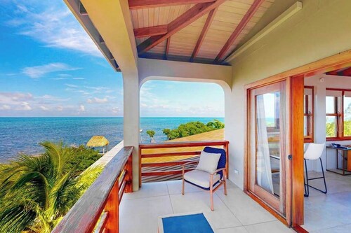 Tropical retreat villa with a pool, dock, bikes, canoes, balconies, and 360 views