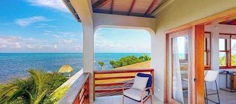 Tropical retreat villa with a pool, dock, bikes, canoes, balconies, and 360 views