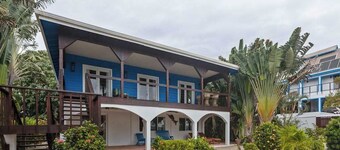 Beachfront home with dock, deck, hammocks, strong WiFi, AC & sea view