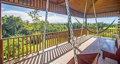 Charming cabin with private balcony, lush views & eco-friendly features