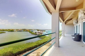 Property grounds - Sunny waterfront villa with outdoor pool, balcony, & AC (San Pedro)