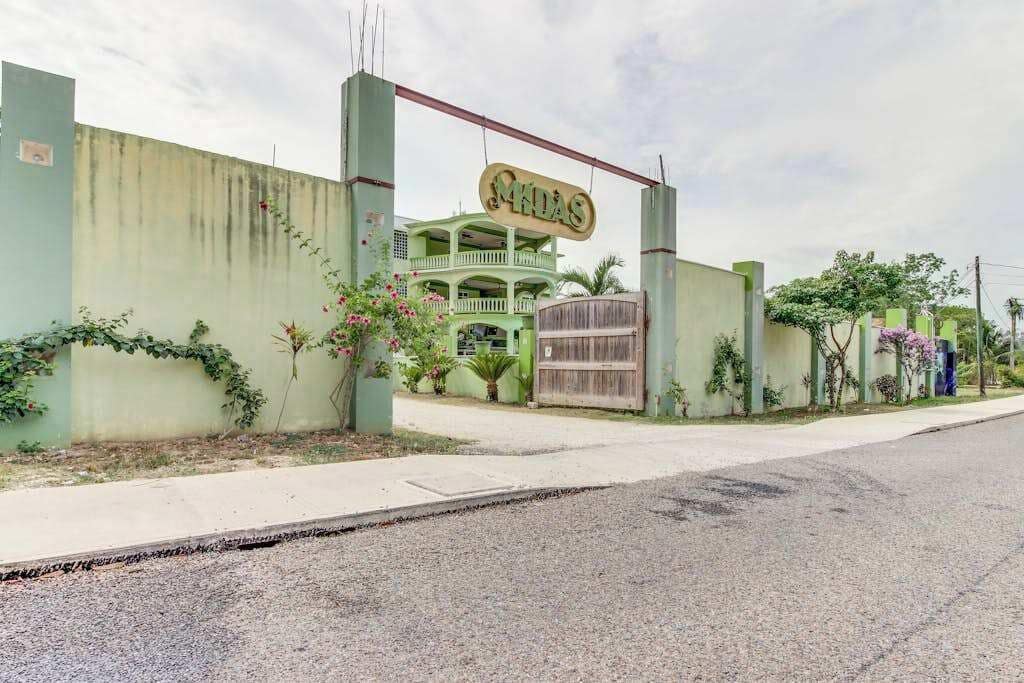 A building with a sign that reads 'MHDAS' and a gated entrance.