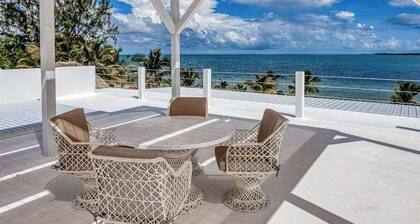 Luxurious beachfront home with private pool, rooftop grill, and sea views