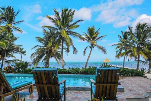 Ground-floor ocean-view condo with dock, pool, full kitchen, & AC
