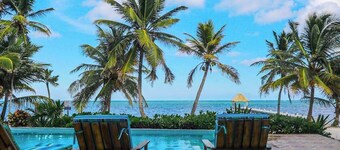 Ground-floor ocean-view condo with dock, pool, full kitchen, & AC