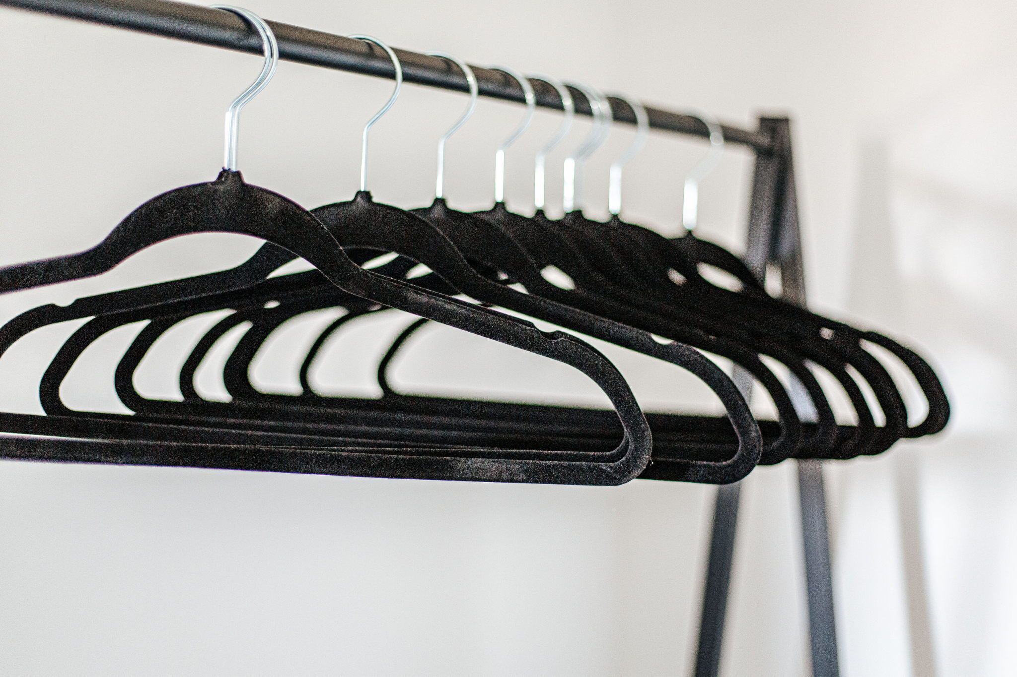 A clothing rack with multiple hangers.