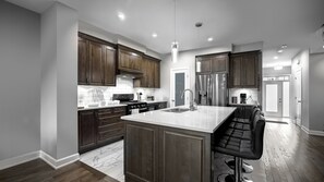 Coffee/tea maker, fridge, microwave, oven