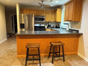 Coffee/tea maker, fridge, microwave, oven