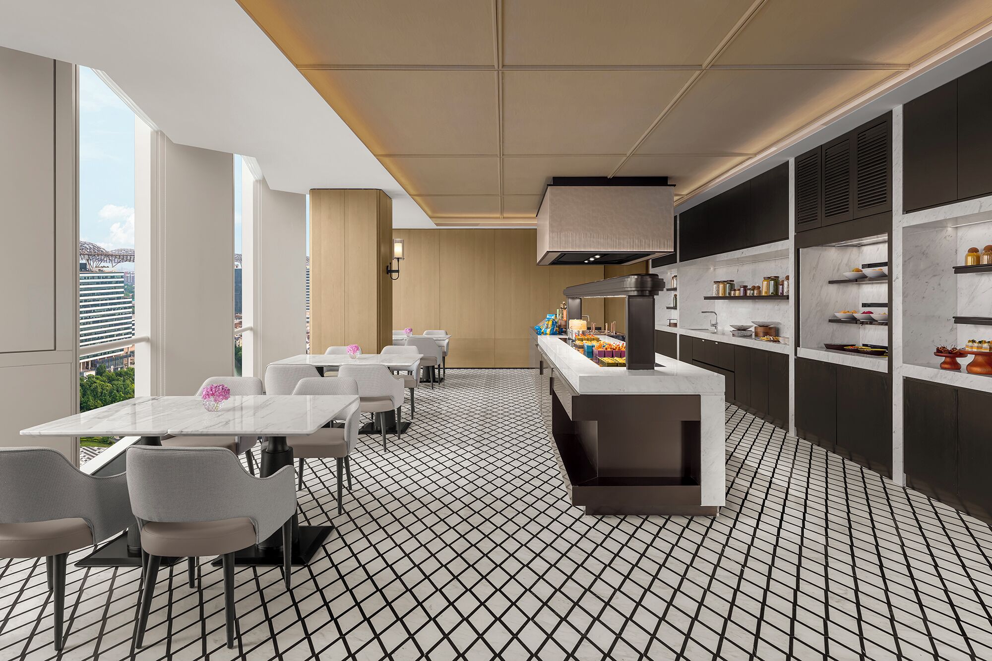 A modern interior with a dining area, kitchen, and large windows offering a city view.