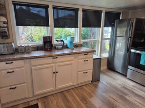 Coffee/tea maker, fridge, microwave, stovetop - Arch Cape cottage with a View (Arch Cape)