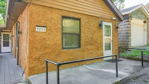 A building with a textured exterior, a number '2853' sign, a window with blinds, and a door. - Dormont, Potomac @3 Stylish and Cozy 2 Bedroom Private Apartment (Pittsburgh)