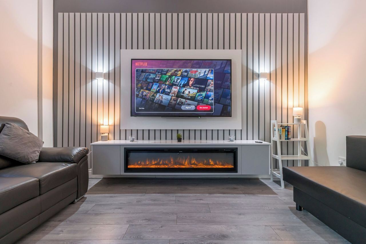 Smart TV, fireplace, books