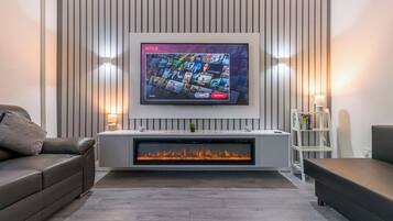Smart TV, fireplace, books