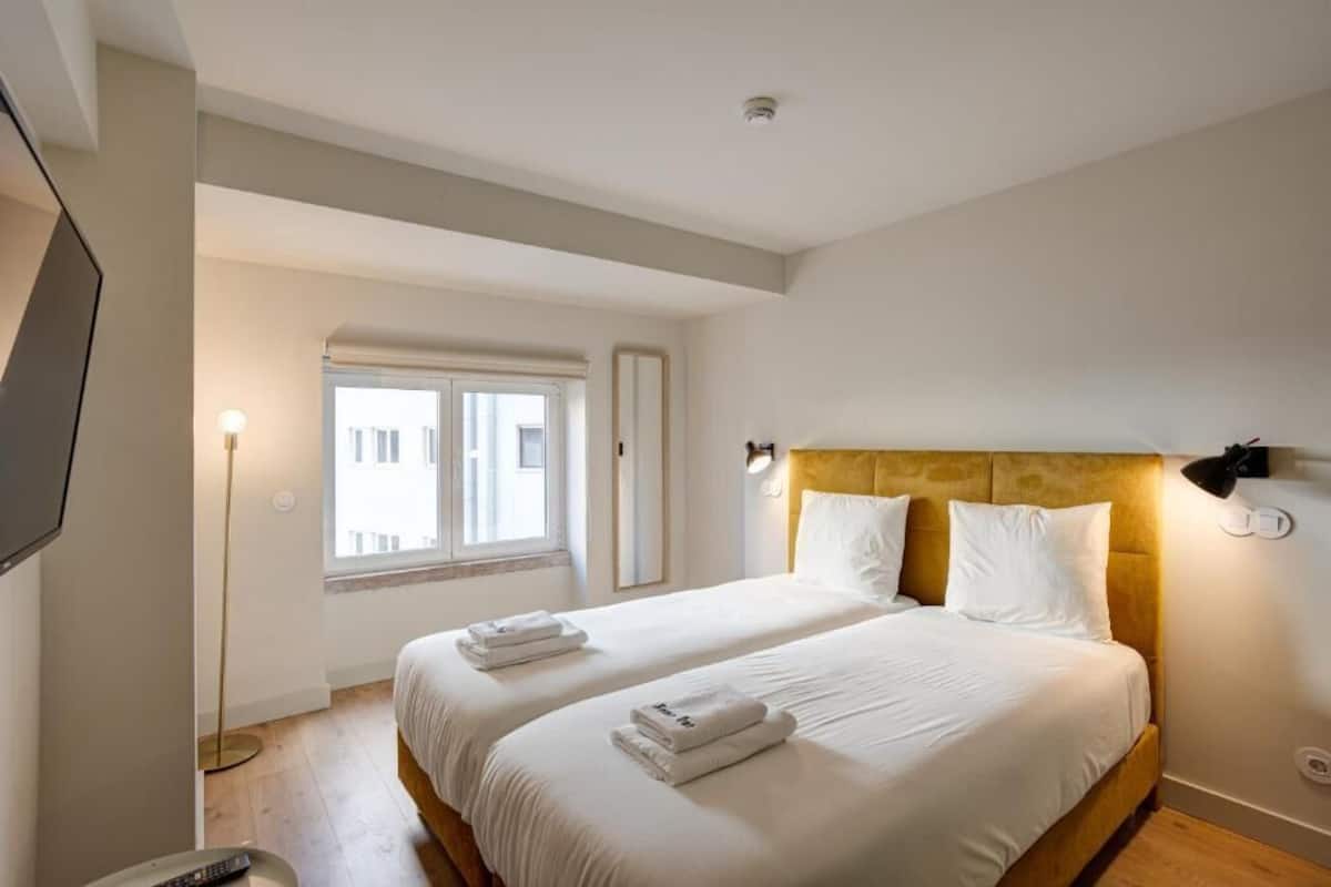 Suite, 2 Twin Beds, City View | In-room safe, iron/ironing board, free WiFi