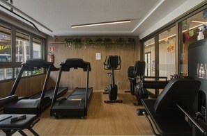 A gym with treadmills, stationary bikes, and exercise equipment. - Atlantic Ocean Barra Near the Lighthouse, Porto Beach and Barra Shopping by Carpediem (Salvador)