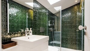 A modern bathroom with a large sink, toilet, and shower area. - Arriaga River Views II (Lisbon)
