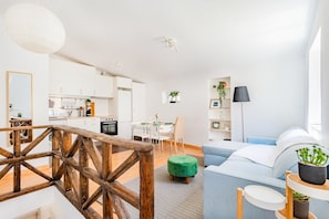 A modern apartment with a kitchen, dining area, and living room. - São José 2BR @ City Center (Lisbon)