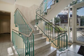 A staircase with green railings and granite steps leading to an outdoor area. - Apartment 'Diana' with Terrace and 300 m from the Beach (Zempin)