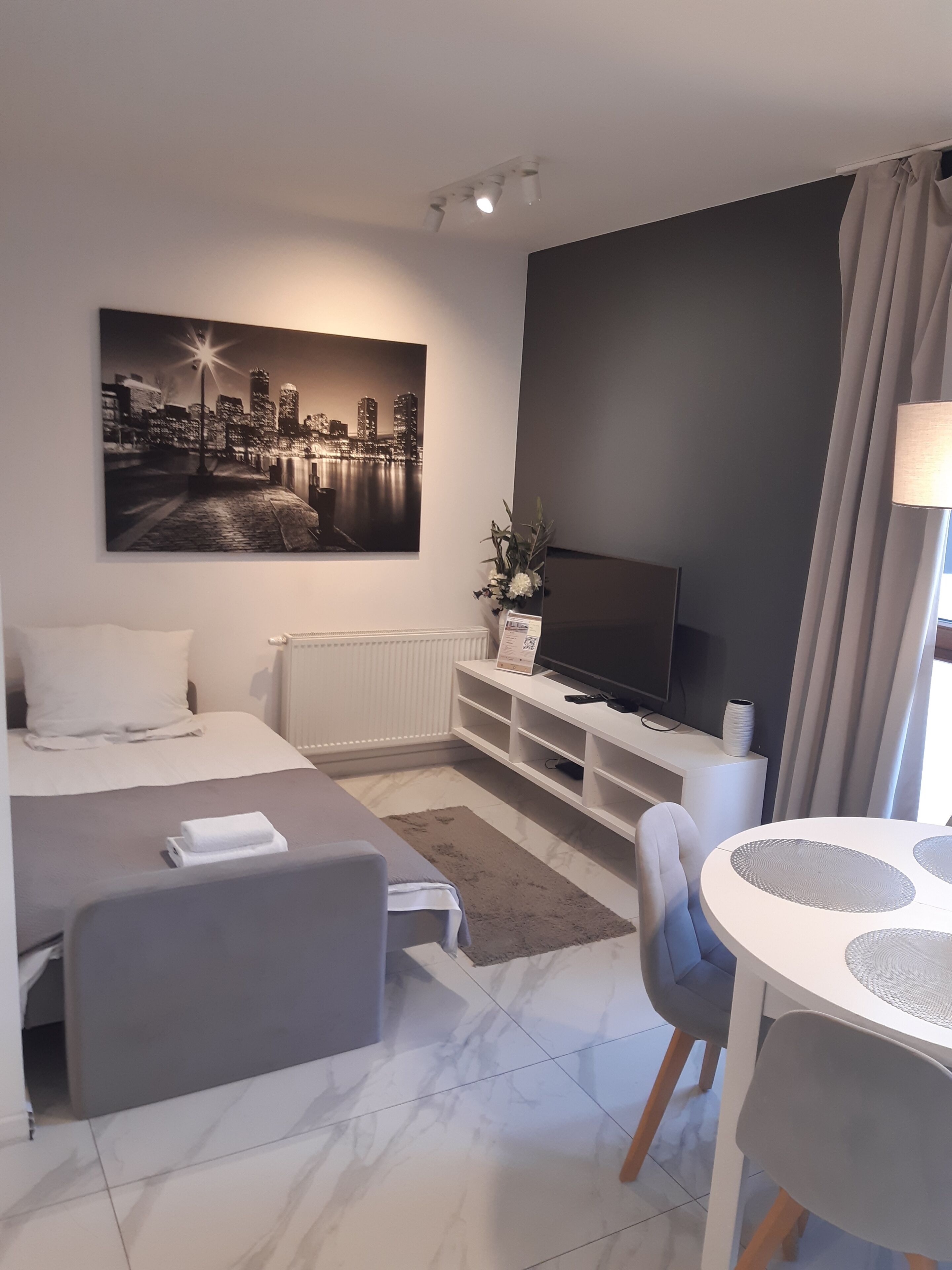 Comfort Apartment, Patio, City View | In-room safe, desk, laptop workspace, iron/ironing board