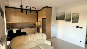 Deluxe Apartment, Patio, City View | Living area