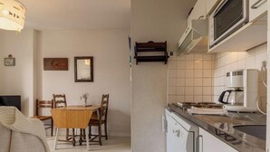 A compact kitchen with a dining area, a built-in microwave, and a coffee maker. - T3 apartment near the beach in Fréhel | 4 guests | Ref 117 (FREHEL)