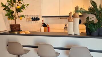 Coffee/tea maker, fridge, microwave, oven