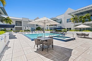 A heated pool - Olde Naples 2BR condo with pool view, heated pool, balcony, and walkable location. (Naples)