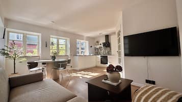 Classic Apartment, 1 Bedroom | Living area | 50-inch Smart TV with digital channels