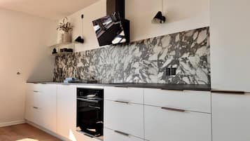 Superior Apartment, 2 Bedrooms, City View | Private kitchen | Full-size fridge, oven, stovetop, dishwasher
