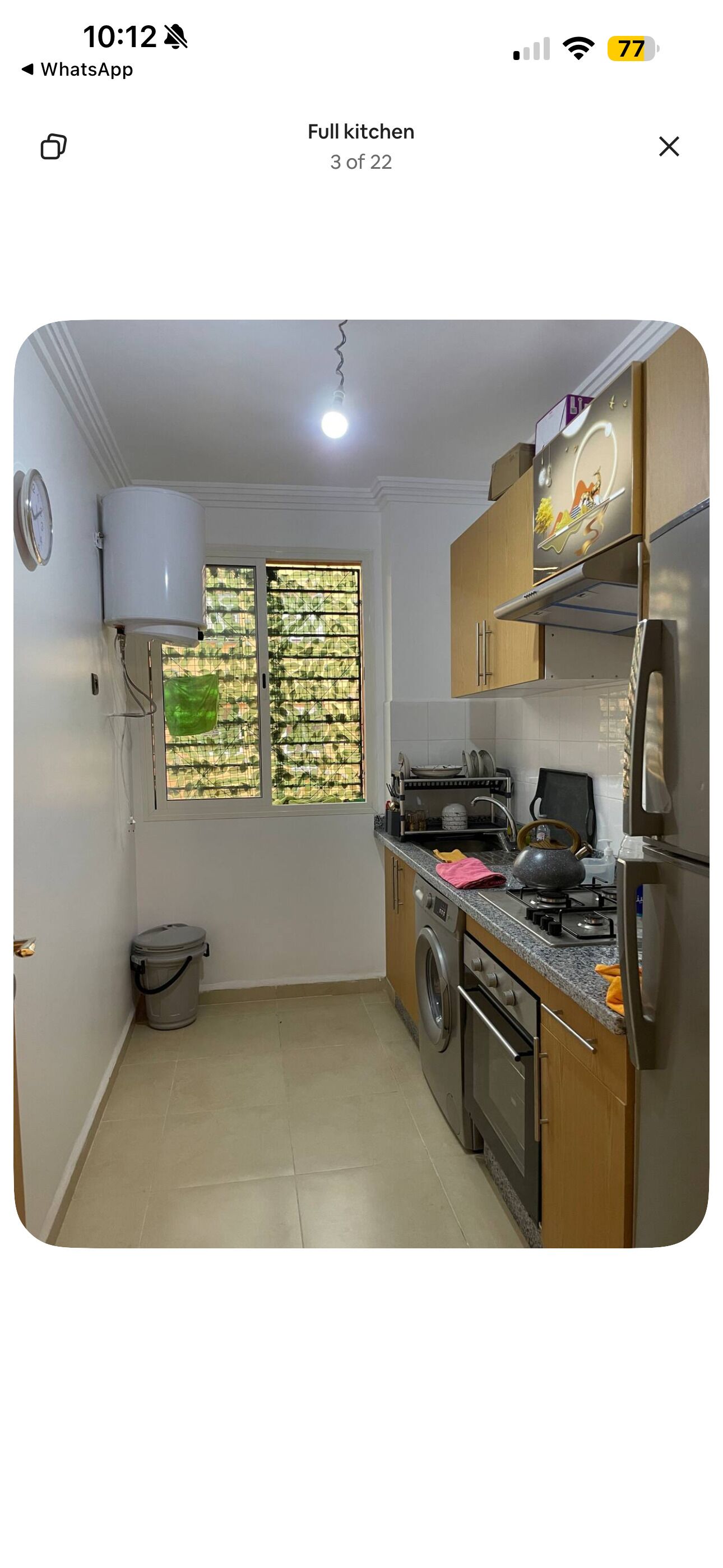 Departamento Confort, vista a la alberca | Cocina privada | Refrigerador con congelador, horno y parrilla de estufa 