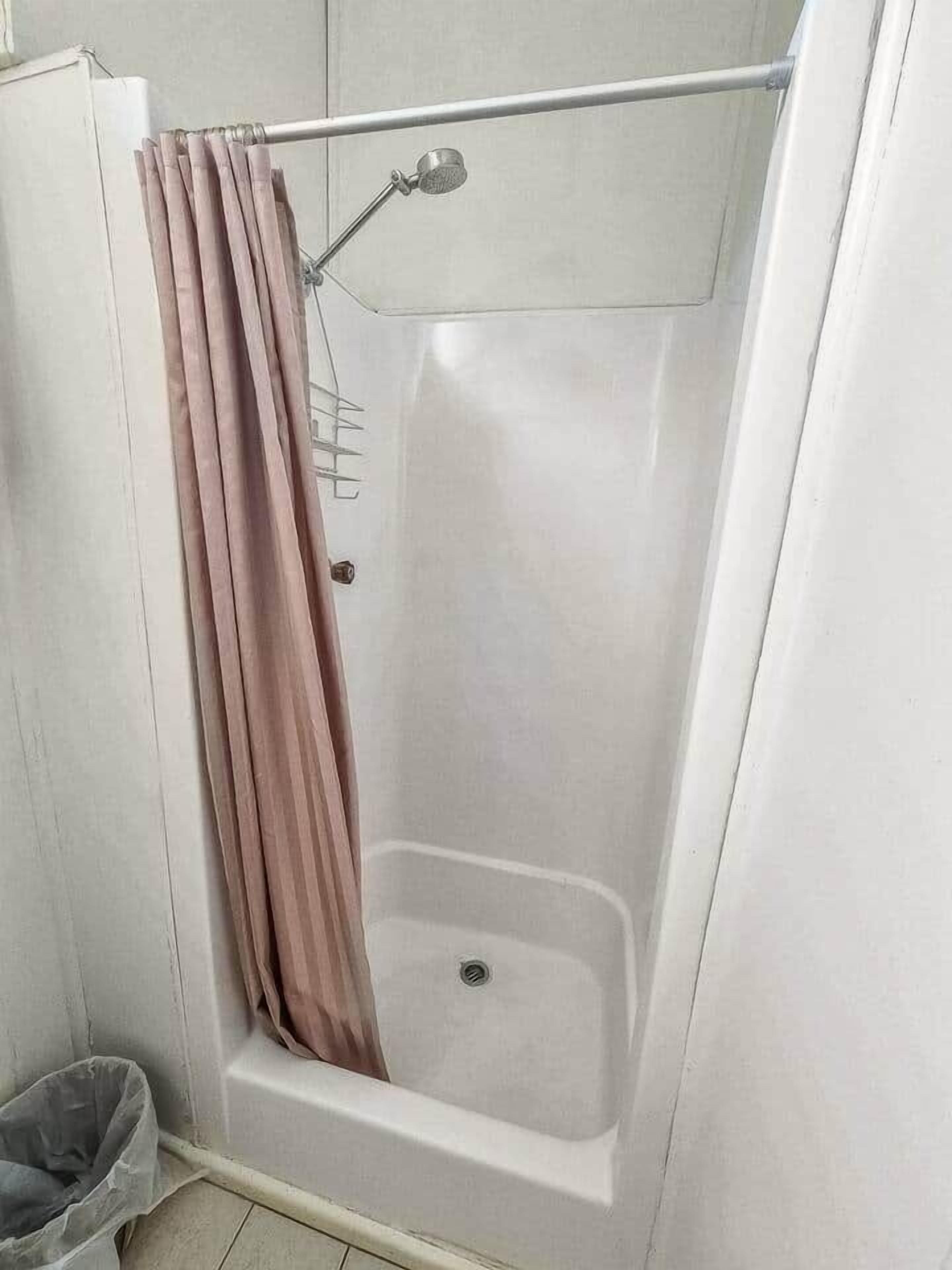 Shower, hair dryer, towels, shampoo